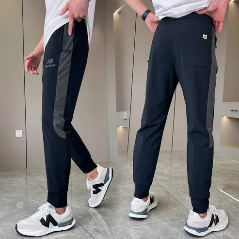 New Balance - Pantaloni ad asciugatura rapida per uomo